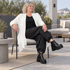 Creme Strickcardigan aus Baumwolle mit Stehkragen Taschen und A-Linie in Glockenform
