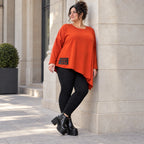 Langarmshirt in kräftigem Orange mit asymmetrischem Zipfelsaum aus weichem Stretchjersey