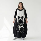 Schwarzes Oversizekleid mit weißem Grafikprint Layerlook Rundhals aus Viskosestretch