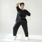 Schwarze Oversizebluse A-Formschnitt aus FrenchTerry mit abstraktem Streifenmuster 34Arm
