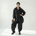 Schwarze Oversizejacke mit Raffdetails langer Schnitt Knopfleiste Taschen Polyester