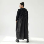 Schwarzes Zweiteiler Maxikleid im Lagenlook mit asymmetrischem Oberkleid und Taschen