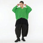 Grüner Strick Überwurf mit Destroyed Optik und V-Ausschnitt für Lagenlook Oversize Damenmode - AKH Premium bei Modeare online Shop kaufen