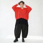 Oversize Strick Überwurf Orange V-Ausschnitt Destroyed Look AKH Premium bei Modeare kaufen für Damen im Lagenlook