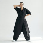 Schwarzer Crashjumpsuit Oversize aus Viskose mit weitem Bein Reverskragen und Taschen
