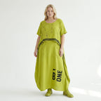 Oversize Maxikleid in neongrün schwarz mit Frontprint Rundhals Taschen Baumwolljersey