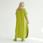 Oversize Maxikleid in neongrün schwarz mit Frontprint Rundhals Taschen Baumwolljersey