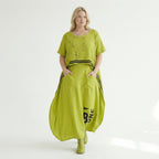 Oversize Maxikleid in neongrün schwarz mit Frontprint Rundhals Taschen Baumwolljersey