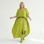 Oversize Maxikleid in neongrün schwarz mit Frontprint Rundhals Taschen Baumwolljersey