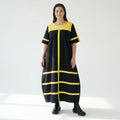 Avantgarde Maxikleid Cadrelli schwarz mit gelben Kontraststreifen aus Viskose-Lycra