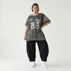 Grauschwarze Oversize Tunika aus Jersey mit Print Meshdetails und asymmetrischem Saum