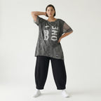 Grauschwarze Oversize Tunika aus Jersey mit Print Meshdetails und asymmetrischem Saum