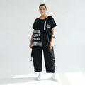 Asymmetrische Oversize-Tunika mit Print, Tasche & Zipper in Schwarz – B-ONE Design