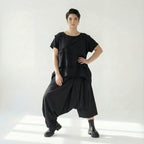 Asymmetrische schwarze Ballonhose aus Baumwolle mit Stretch oversized Eingrifftaschen