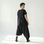 Asymmetrische schwarze Ballonhose aus Baumwolle mit Stretch oversized Eingrifftaschen