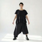 Asymmetrische schwarze Ballonhose aus Baumwolle mit Stretch oversized Eingrifftaschen