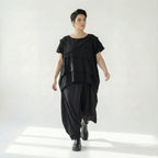 Asymmetrische schwarze Ballonhose aus Baumwolle mit Stretch oversized Eingrifftaschen