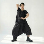 Asymmetrische schwarze Ballonhose aus Baumwolle mit Stretch oversized Eingrifftaschen